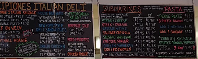 Chalkboard menus
Left" Sausage, Burgers, Deli Sandwiches, Salad, Soup, Fries, Chicken Fingers
Right: Submarines, Pasta, Stuffed Banana Peppers