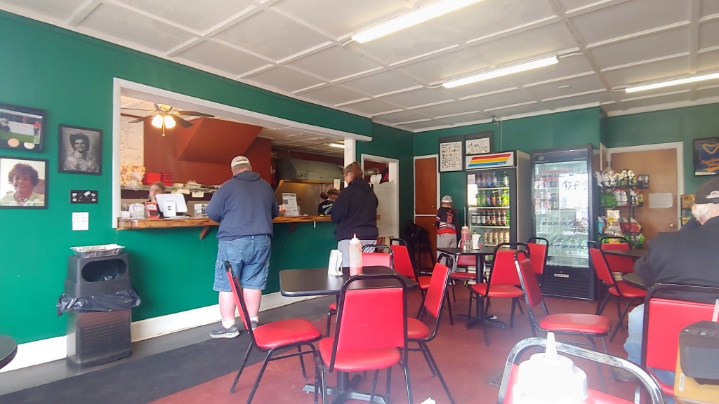 Inside view of Mileto's, showing tables and the counter