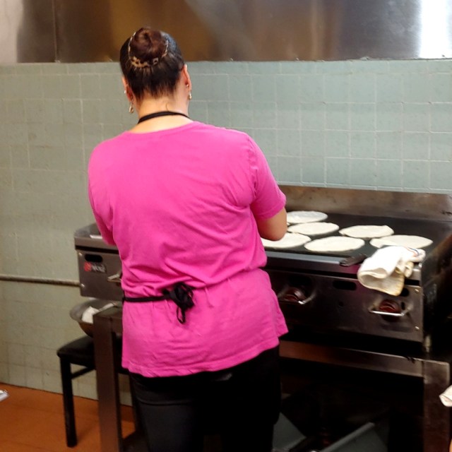 Cook making fresh tortillas