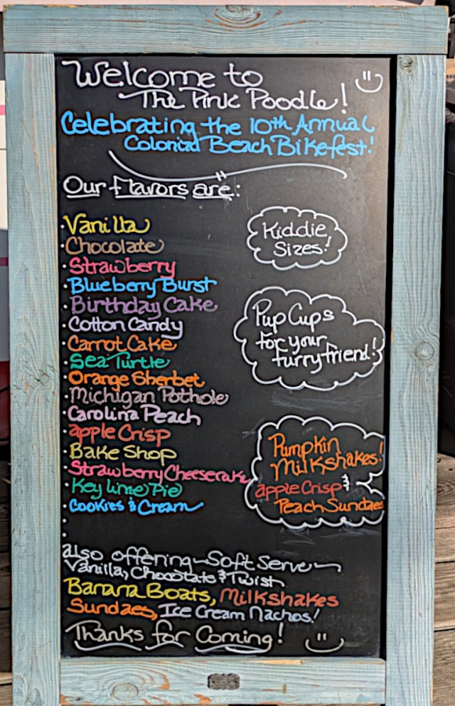 Chalk board displaying "Welcome to The Pink Poodle" along with flavors.