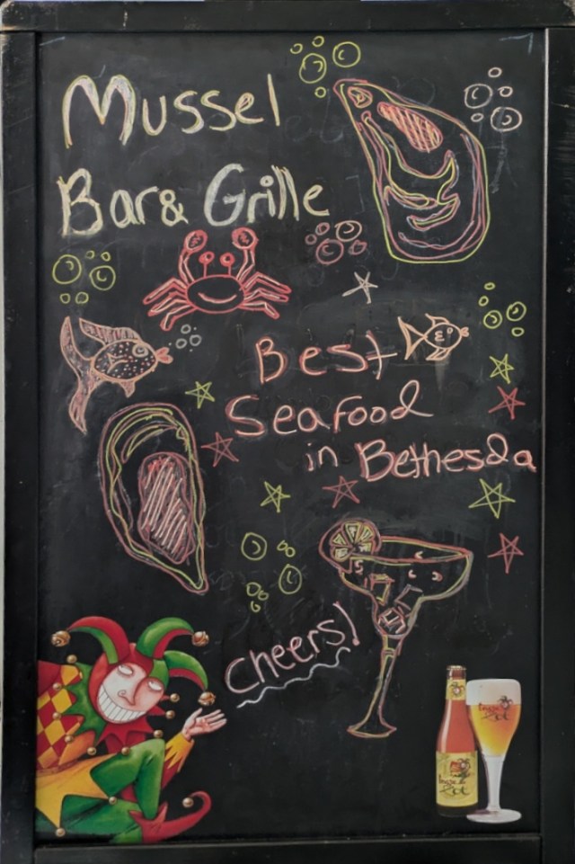 Chalkboard sign saying "Best Seafood in Bethesda"
