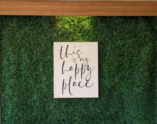 yGrass wall with a "This is my Happy Place" sign
